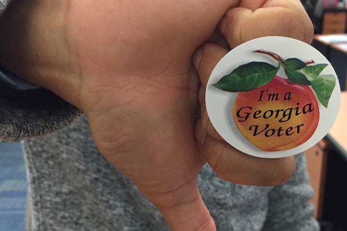 Dissatisfied with both Trump and Clinton, some Georgia voters are only voting in down-ballot races.