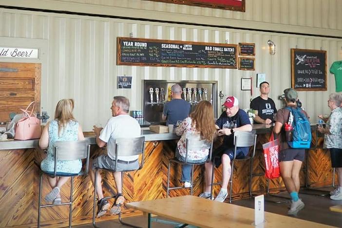 Customers enjoy beer at Service Brewing in Savannah. 