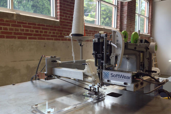 Robotic sewing machines, like this one created by SoftWear Automation, could change the garment industry and bring jobs back to Georgia.