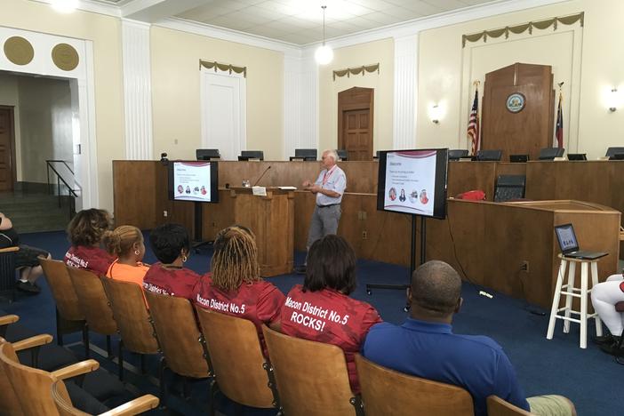 Red Cross trainer Gaines Harman trains volunteers in Macon Government Center.