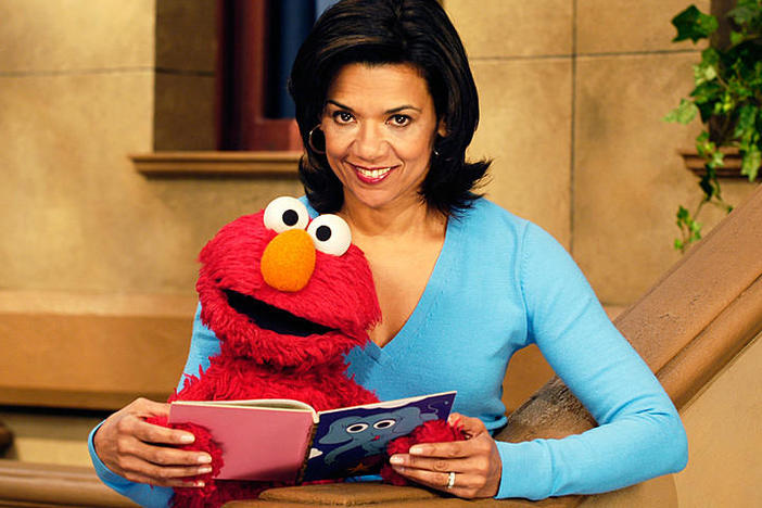 Sonia Manzano, as Maria, with Elmo on "Sesame Street."