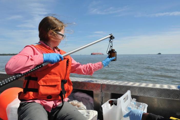 St. Simons Sound Incident water quality team member Laura Hassold PrÃ©vot, environmental scientist, retrieves a water sample from the St. Simons Sound. Altamaha Riverkeeper and UGA are doing their own, separate, collection and testing.