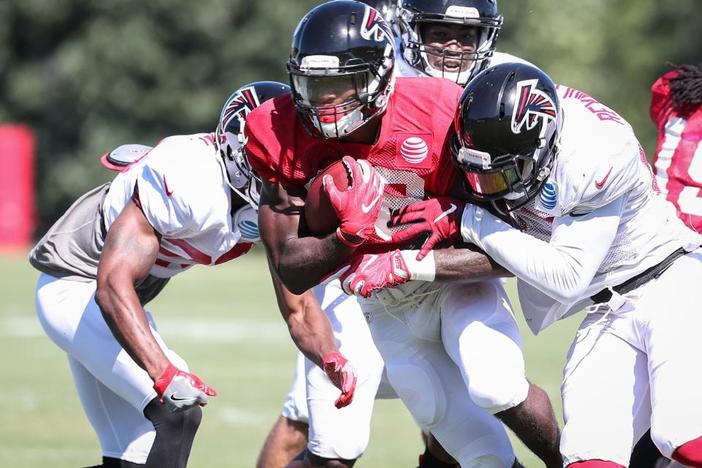 Members of the Atlanta Falcons practice at the team's training camp.
