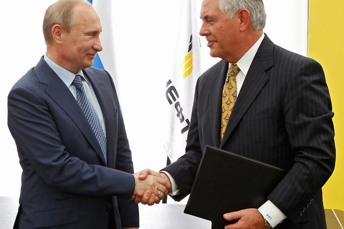 Russian President Vladimir Putin, left, and ExxonMobil CEO Rex Tillerson shake hands at a signing ceremony of an agreement between state-controlled Russian oil company Rosneft and ExxonMobil at the Black Sea port of Tuapse on June 15, 2012,.