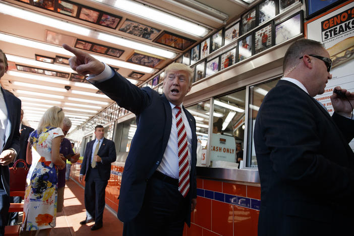 Republican presidential candidate Donald Trump talks with customers during a visit to Geno's Steaks, Thursday, Sept. 22, 2016, in Philadelphia.