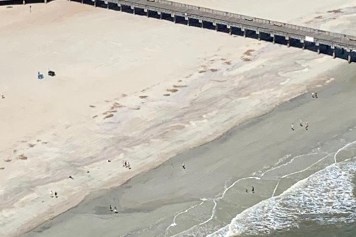 Gov. Brian Kemp shared this aerial photo in a tweet Saturday, saying most beachgoers were locals. But Tybee officials say with beaches reopened, they're now getting visitors from out of state.