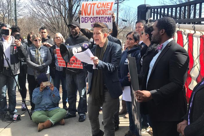 Stephanie Guilloud of Project South speaks at a rally against President Trump's declaration of a national emergency for border wall funding. 