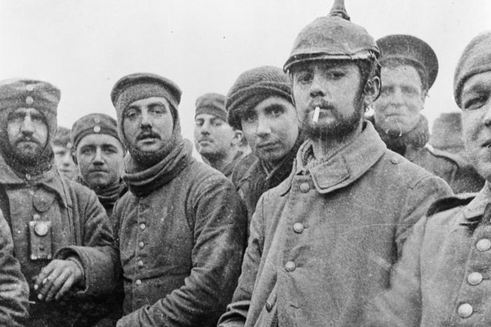 British and German soldiers fraternizing at Ploegsteert, Belgium, on Christmas Day 1914. 