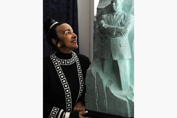 Xernona Clayton, who was a special assistant to Martin Luther King, Jr., looks at a model of the Stone of Hope, the centerpiece of the Martin Luther King, Jr. National Memorial Project.