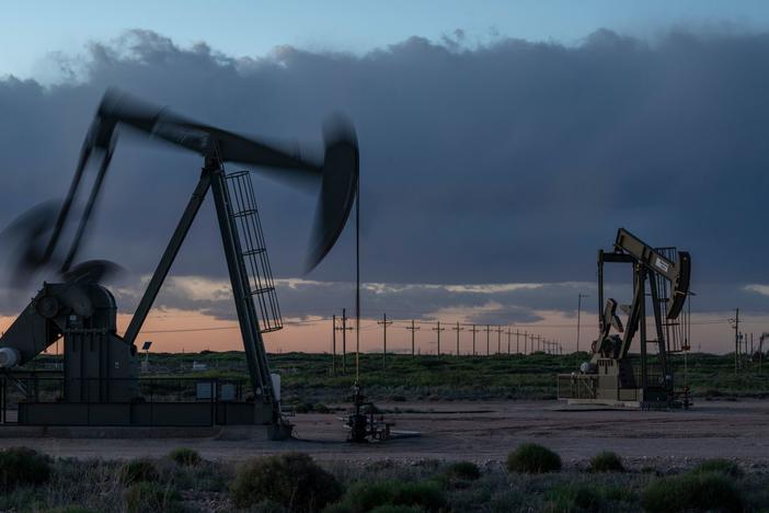 Pump jacks operate at dusk near Loco Hills in Eddy County, New Mexico, on April 23. U.S. oil producers are grappling with prolonged low oil prices and the uncertainty created by the coronavirus pandemic.