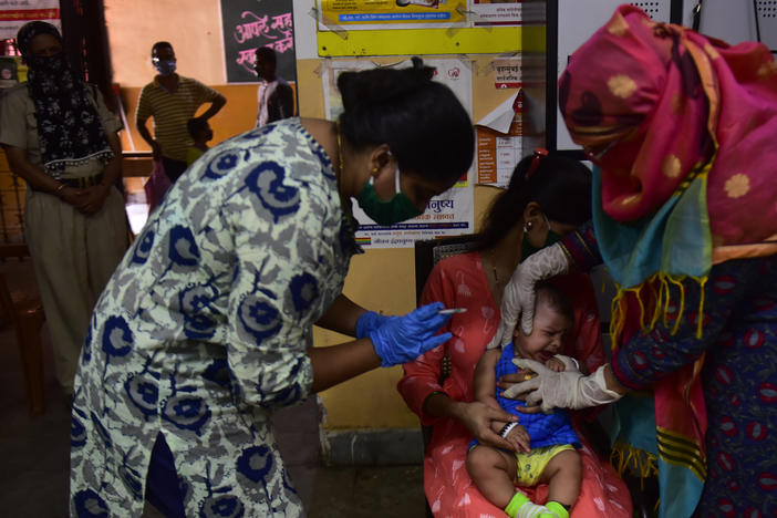 Medical staff in Mumbai, India,  last week. A U.N. report warns that the coronavirus pandemic is interfering with children getting vaccinated.