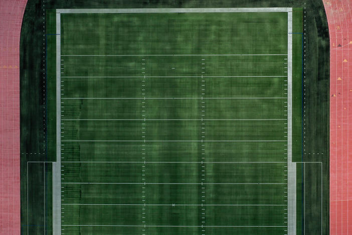 An aerial view of an empty football field at Towson University in Towson, Md. Many colleges rely on summer camps for additional revenue during the summer.