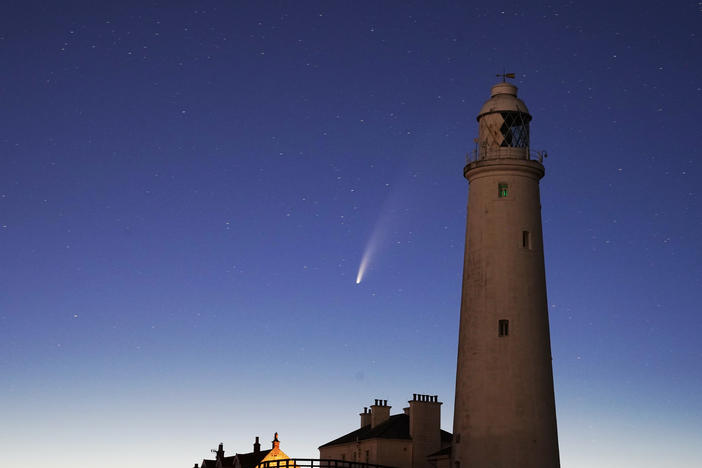 Comet Neowise passes St. Mary's Lighthouse in Whitley Bay, U.K., in the early hours of Tuesday morning.
