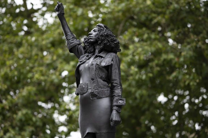 A new sculpture by local artist Marc Quinn, depicting Black Lives Matter protester Jen Reid, stands on the plinth where the Edward Colston statue used to rest in Bristol.