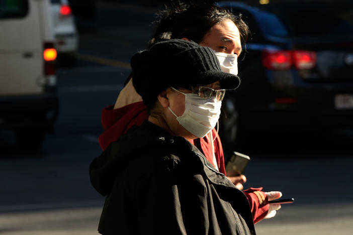 People in Melbourne, Australia, wearing face masks on Thursday. Victoria has recorded 317 new cases of coronavirus in 24 hours, the highest daily total recorded in the state since the pandemic began.