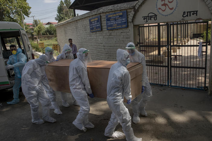 Indian paramilitary soldiers carry the body of a paramilitary officer who died of COVID-19 to a crematorium in Srinagar, Indian-controlled Kashmir, on Tuesday. India is the third-ranked nation in the number of reported infections.