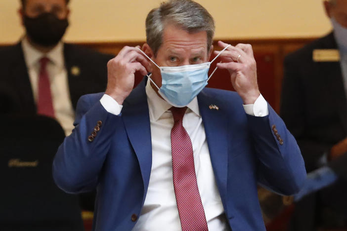 Georgia Gov. Brian Kemp gave a coronavirus briefing at the Capitol Friday, in Atlanta. Kemp has filed a lawsuit against the city over its face-mask requirement.