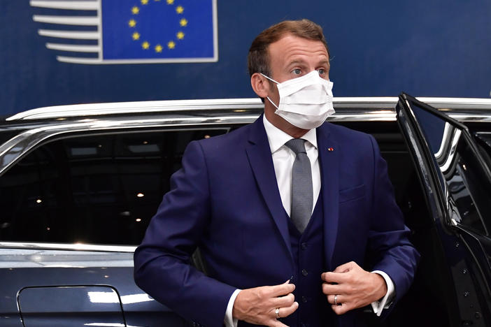 France's President Emmanuel Macron arrives Friday for a European Union meeting in Brussels, where leaders of the 27-member bloc will hold their first face-to-face summit since the pandemic to discuss a COVID-19 economic rescue plan.