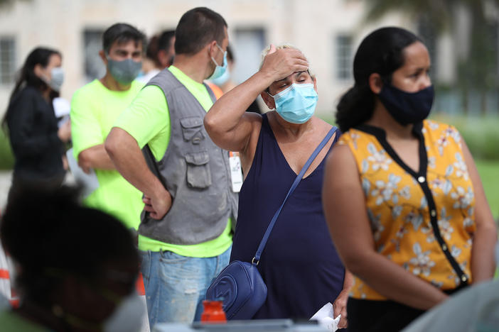 Carmen Garcia stands in line on Friday to be tested for COVID-19 at a Mobile Testing Truck in Miami Beach, Fla. The units were brought to the area as the cases of coronavirus spike in Florida.