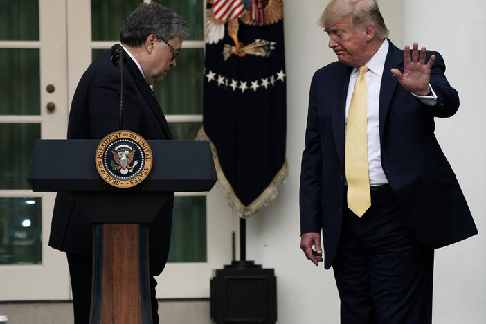 President Trump departs a July 2019 press conference on the census with U.S. Attorney General William Barr (center) and Commerce Secretary Wilbur Ross in the White House Rose Garden.