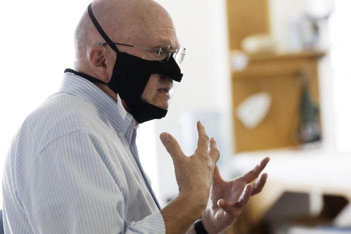 Michael Conley, who is deaf, models a mask that has a transparent panel in San Diego on June 3. Face coverings can make communication harder for people who rely on reading lips, and that has spurred a slew of startups and volunteers to make masks with plastic windows.