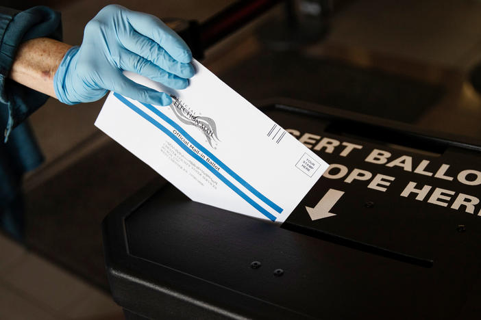 A voter casts a mail-in ballot at a drop box in West Chester, Pa., prior to the June 2 primary election. Statewide, Pennsylvania saw a nearly 18-fold increase in mail-in voting in the primary compared with 2016.