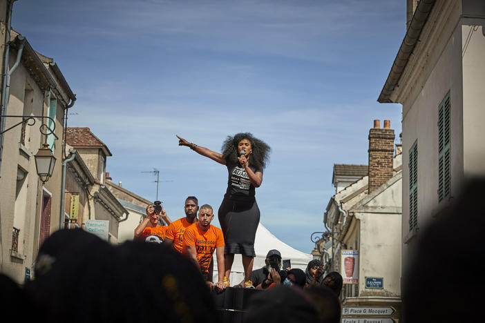 Assa Traoré addresses a crowd during a demonstration in Persan, France, to commemorate the fourth anniversary of her brother Adama Traoré's death. "The fight for justice for Adama belongs to all of France," she says.