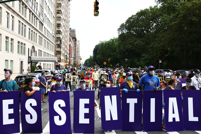 Members of the 32BJ union participate in a "Strike for Black Lives" rally in New York City, one of the many demonstrations for racial and economic justice that took place across the U.S. on Monday.