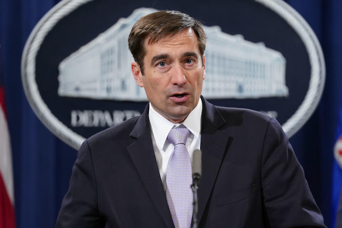 John Demers, assistant attorney general for national security, announces a law enforcement case involving China in November 2018. The Justice Department is prosecuting more alleged cybercrime cases.