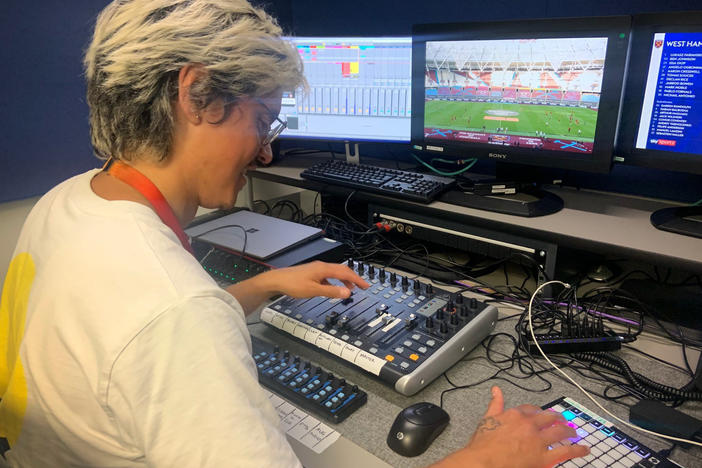 Adam Peri, sound supervisor with the broadcaster Sky UK, mixes recorded fan sounds into a Premier League soccer match.