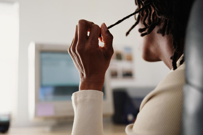 An unidentified young man wears his hair in dreadlocks in this file photo. A Texas school district won't change its policy on long hair — effectively continuing a de facto ban on dreadlocks, attorneys for suspended students told NPR.