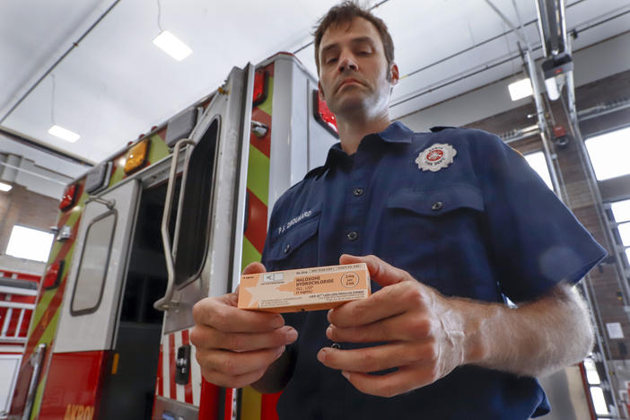 Fire medic Paul Drouhard shows a box containing naloxone that is carried in all the department's emergency vehicles. The drug commonly called Narcan is used primarily to treat narcotic overdoses. 