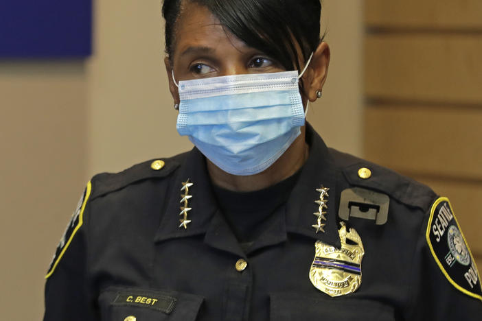 Police Chief Carmen Best listens during a news conference at City Hall in Seattle on July 13. Best is critical of a plan backed by several city council members that seeks to cut the police department's budget in half.