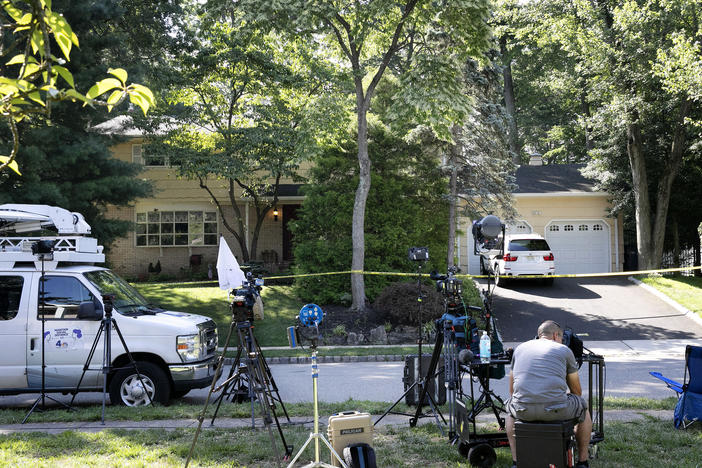 News media set up in front of the home of U.S. District Judge Esther Salas on Monday in North Brunswick, N.J. A gunman posing as a delivery person shot and killed Salas' 20-year-old son Sunday.
