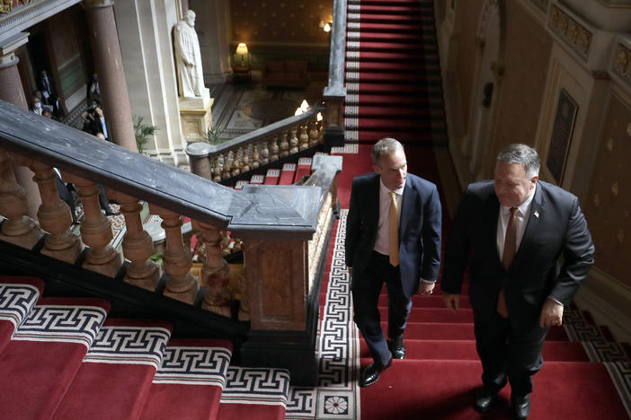 U.K. Foreign Secretary Dominic Raab, left, and U.S. Secretary of State Mike Pompeo walk up the stairs in the Foreign Office in London on Tuesday.