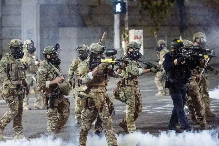 Federal agents use crowd control munitions to disperse protesters this week at the Mark O. Hatfield U.S. Courthouse in Portland, Ore.