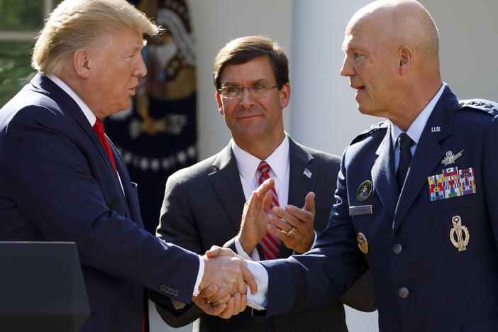 Gen. John "Jay" Raymond, with President Trump and Defense Secretary Mark Esper during a ceremony to establish the U.S. Space Command last summer.