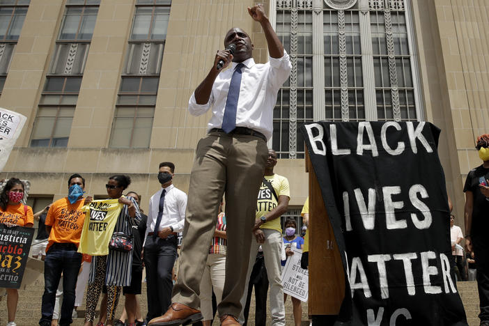 Mayor Quinton Lucas talks to demonstrators during a rally on the steps of City Hall in Kansas City, Mo., on June 5.