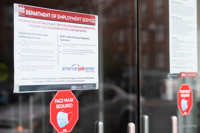 Signs are displayed outside the Washington, D.C., Department of Employment Services. New claims for unemployment benefits around the country rose for the first time in four months.