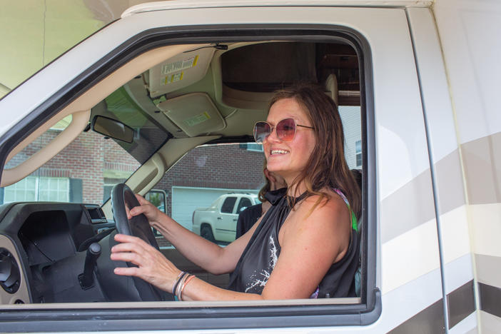 Amy Holditch settles in behind the wheel of the RV she rented for her 10-day family trip from Madison, Ala. to Cape Cod, Mass.