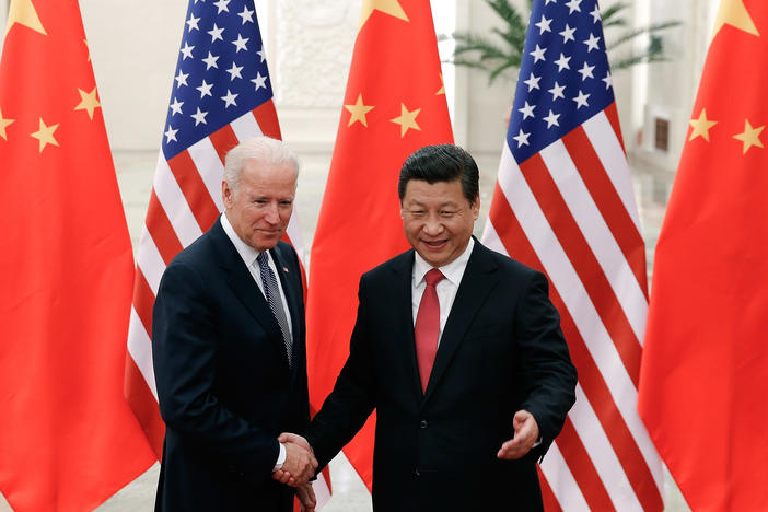 Then-Vice President Joe Biden shakes hands with Chinese President Xi Jinping in Beijing on Dec. 4, 2013. "I've traveled 17,000 miles with him," Biden told attendees at a campaign rally in Nevada earlier this year.