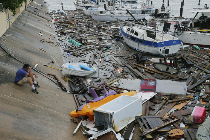 Allen Heath surveys the damage to a private marina in Corpus Christi after it was hit by Hanna, the hurricane that was later downgraded to a tropical storm, on Sunday. Heath's boat and about 30 others were lost or damaged.