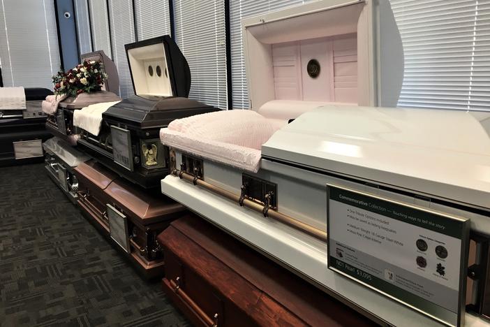 Caskets on display at Serenity Funeral Home in Kansas City, Mo., where many of the city's homicide victims are memorialized.