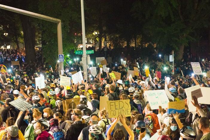 Protests in Portland, shown here on July 24, have grown increasingly heated with the presence of federal agents. On Monday, groups and individual protesters sued the federal government over its response.