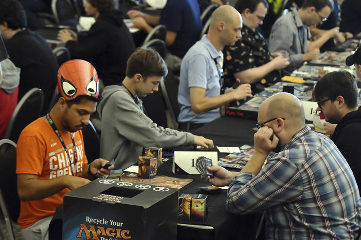Players compete in a <em>Magic: The Gathering</em> tournament at Hasbro's HASCON in 2017.