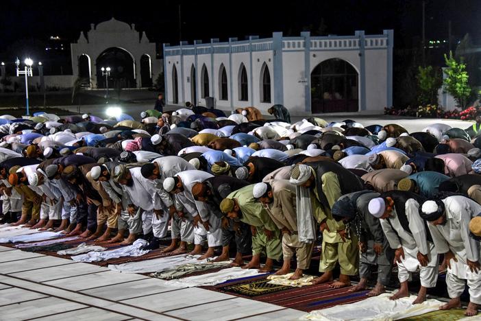 Muslims partake in evening prayers at a mosque in Kandahar, Afghanistan, in April. The Taliban have declared a cease-fire for an upcoming holiday.