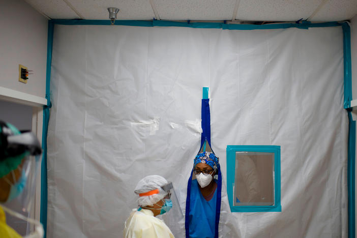 Healthcare workers talk in the Covid-19 unit at United Memorial Medical Center in Houston, Texas in July.