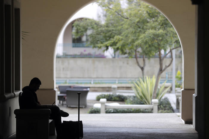 A man studies on the San Diego State University campus on March 12. San Diego State is a part of the California State University system and will be subject to the new general education requirement.