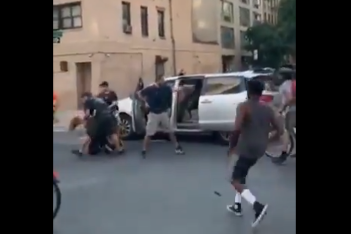 A video posted to social media shows police detain a woman during a New York City protest and shove her into an unmarked van.