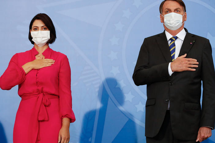 Michelle Bolsonaro tested positive on Thursday — days after her husband, Brazilian President Jair Bolsonaro, said he had recovered from the disease. The pair are seen here at an event on Wednesday.
